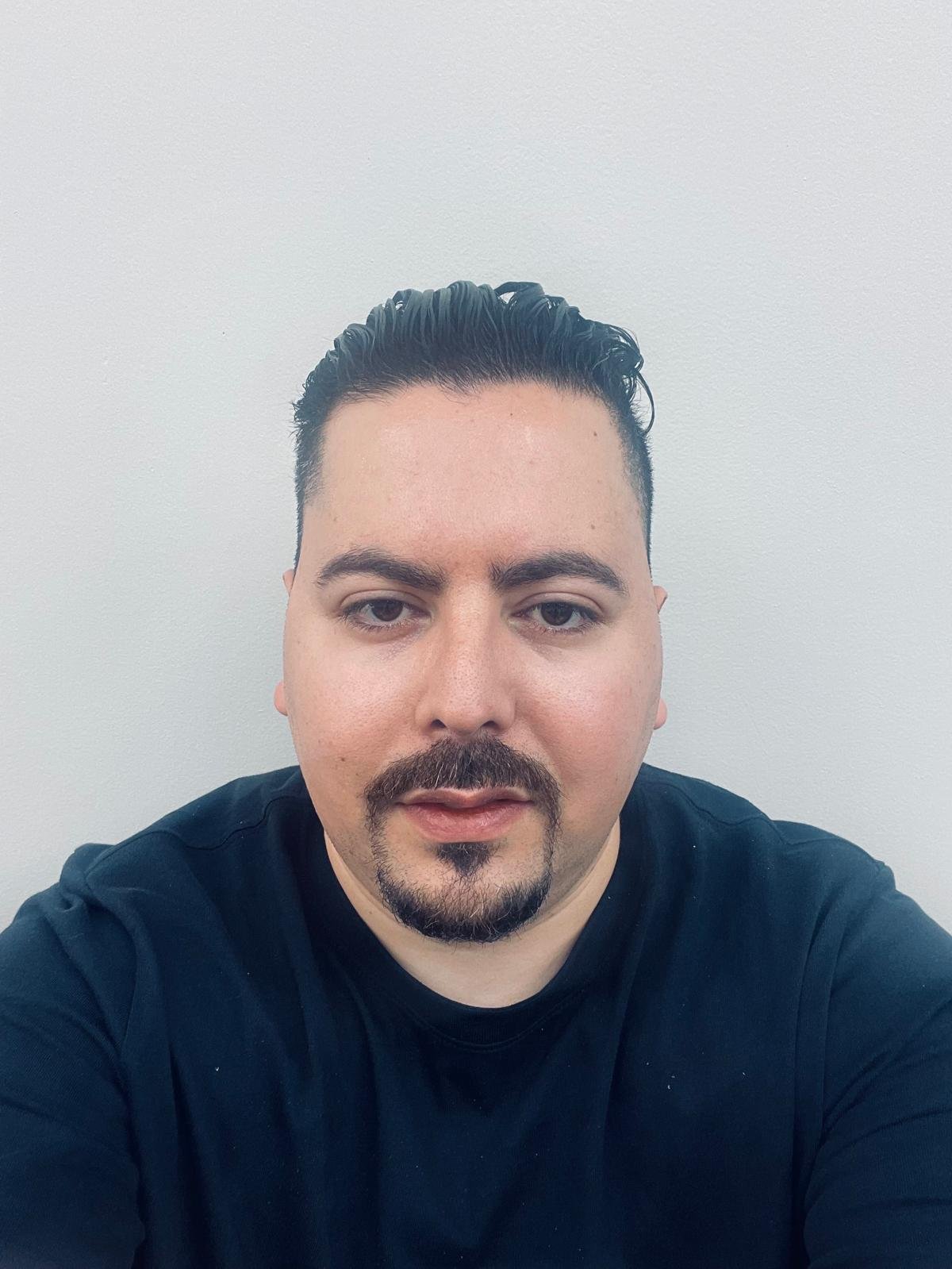 Othmane — Owner and Master Barber at Belvedere Barbershop